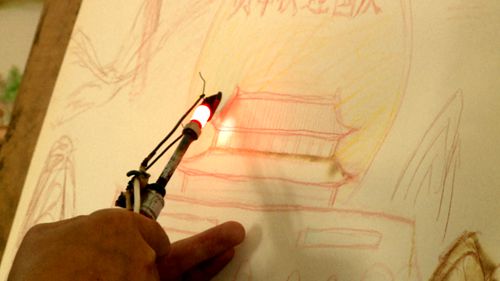 许光建： 画烙画   庆“十一”